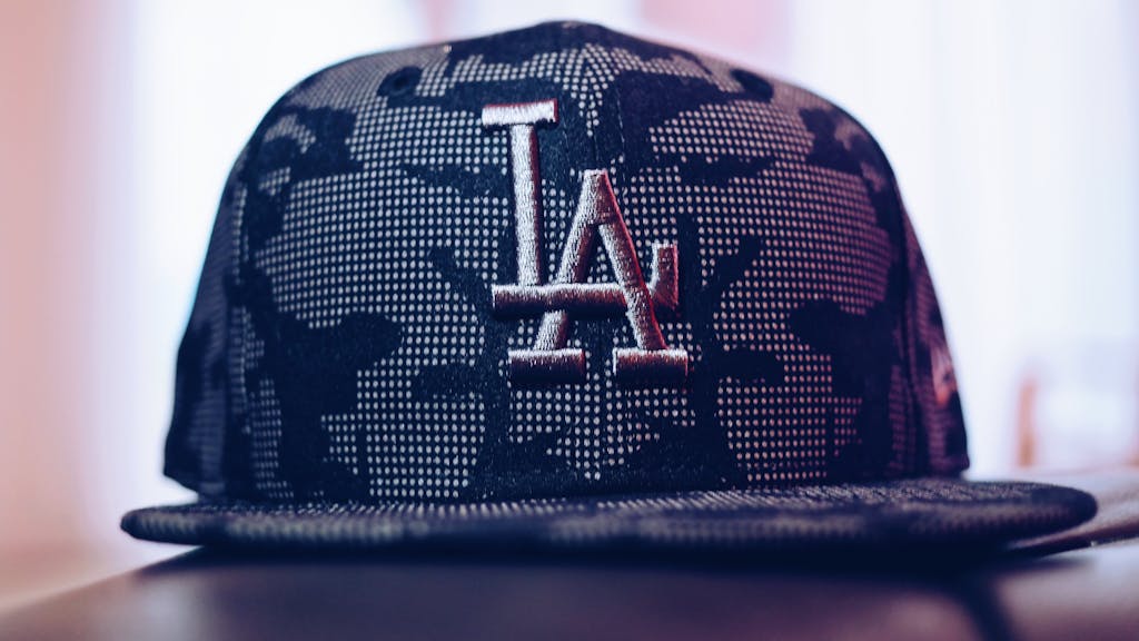 Close-up of a trendy Los Angeles baseball cap with a modern design indoors.