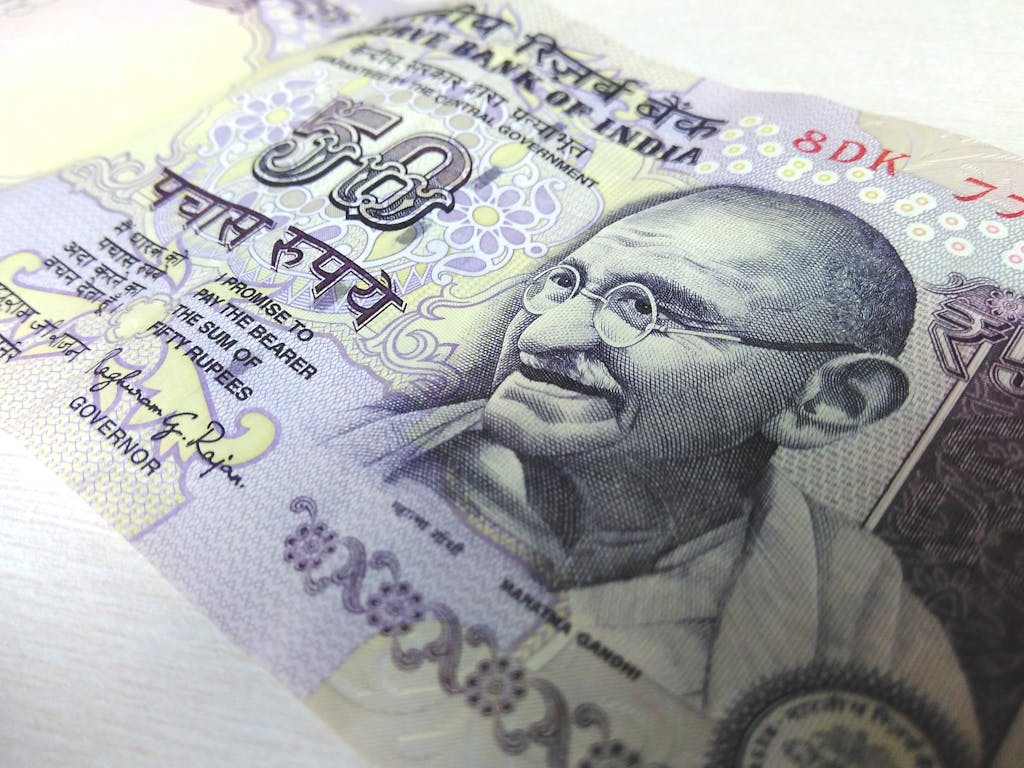 Detailed close-up of an Indian 50 rupee banknote featuring Mahatma Gandhi, highlighting security features.